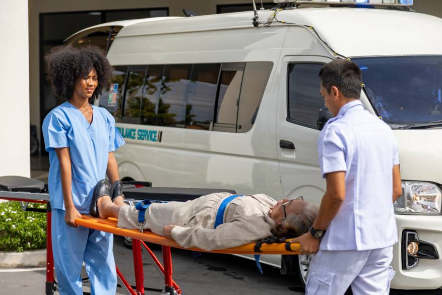 Emergency responders transporting an injured person on a stretcher, symbolizing the serious accidents, injuries, and fatalities caused by speeding drivers in Missouri.