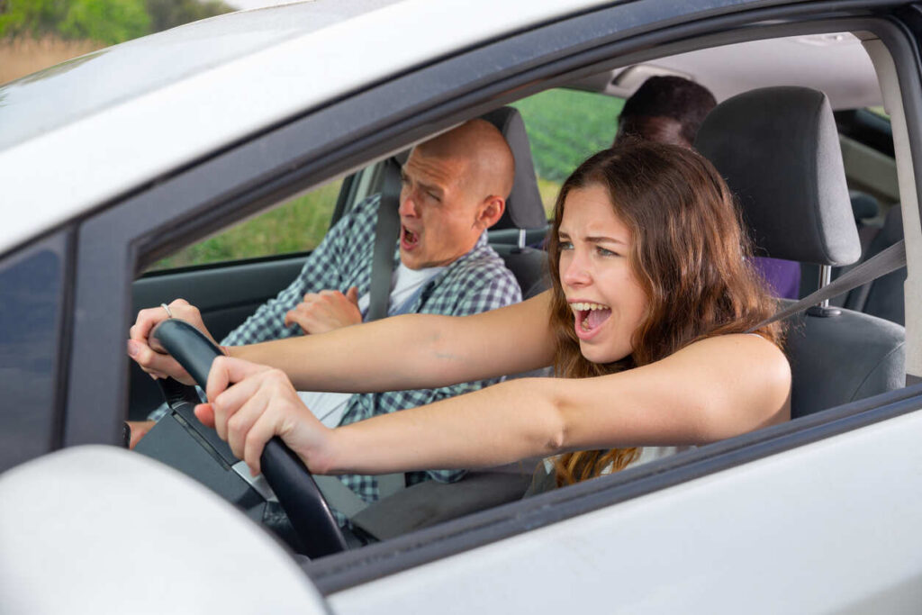 Individuals in a vehicle appearing distressed, symbolizing the danger to passengers in car accidents, especially those involving impaired driving.